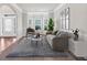 Living room with bay window, neutral decor, and comfortable seating at 845 Nevis Way, Mcdonough, GA 30253
