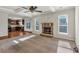 Living room with fireplace and hardwood and carpeted floors at 845 Nevis Way, Mcdonough, GA 30253