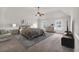 Large main bedroom with carpeted floors and ceiling fan at 845 Nevis Way, Mcdonough, GA 30253