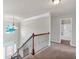 Upstairs hall with bathroom and carpet flooring at 845 Nevis Way, Mcdonough, GA 30253