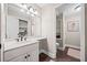 Clean bathroom with white vanity and dark brown floor tile at 103 Cardinal Se Rd, White, GA 30184