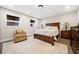 Relaxing bedroom with wood furniture and stylish lamps at 103 Cardinal Se Rd, White, GA 30184