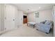 Cozy bedroom with a comfortable sitting area and plenty of closet space at 103 Cardinal Se Rd, White, GA 30184
