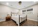 Cozy bedroom with metal bed frame and tile flooring at 103 Cardinal Se Rd, White, GA 30184