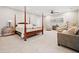 Bright bedroom with a four poster bed and sitting area at 103 Cardinal Se Rd, White, GA 30184