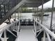 Covered boat dock with lift and spacious area for docking at 103 Cardinal Se Rd, White, GA 30184