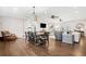 Large dining room with hardwood floors and farmhouse table at 103 Cardinal Se Rd, White, GA 30184