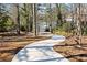 Private winding driveway leading to a lakefront home at 103 Cardinal Se Rd, White, GA 30184