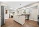 Eat-in kitchen with island and view into dining area at 103 Cardinal Se Rd, White, GA 30184