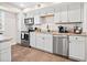 Modern kitchen with stainless steel appliances and granite countertops at 103 Cardinal Se Rd, White, GA 30184