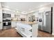 Spacious kitchen with island, stainless steel appliances, and white cabinets at 103 Cardinal Se Rd, White, GA 30184