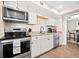 Updated kitchen featuring stainless steel appliances and white cabinets at 103 Cardinal Se Rd, White, GA 30184