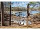 Steps lead down to a private lakefront dock with multiple slips at 103 Cardinal Se Rd, White, GA 30184