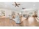 Bright living room with hardwood floors, two ceiling fans and comfy furniture at 103 Cardinal Se Rd, White, GA 30184