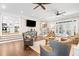 Open concept living room with kitchen view, hardwood floors and comfortable furniture at 103 Cardinal Se Rd, White, GA 30184