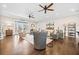 Open concept living room with hardwood floors, fireplace, and French doors at 103 Cardinal Se Rd, White, GA 30184