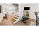 Stairwell leading upstairs, with exercise equipment below at 103 Cardinal Se Rd, White, GA 30184