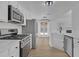 Modern kitchen with stainless steel appliances and white cabinets at 827 White Dove Dr, Mcdonough, GA 30253