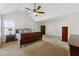 Spacious main bedroom with high ceilings and wood furniture at 960 Maple Leaf Dr, Mcdonough, GA 30253