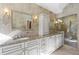 Elegant bathroom with double vanity and luxurious stone accents at 685 Greystone Ne Park, Atlanta, GA 30324