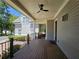 Covered back porch with wood decking and ceiling fan at 5981 Brundage Ln, Norcross, GA 30071