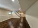 Finished basement with hardwood floors and a staircase at 5981 Brundage Ln, Norcross, GA 30071