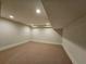 Finished basement room with neutral carpeting at 5981 Brundage Ln, Norcross, GA 30071