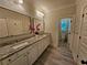 Double vanity bathroom with granite countertops and modern fixtures at 5981 Brundage Ln, Norcross, GA 30071