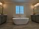 Luxurious bathroom with freestanding tub and double vanities at 5981 Brundage Ln, Norcross, GA 30071