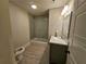Modern bathroom with subway tile, a glass shower, and a marble vanity at 5981 Brundage Ln, Norcross, GA 30071