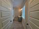 Bathroom hall with tile flooring and access to two bathrooms at 5981 Brundage Ln, Norcross, GA 30071