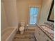 Bathroom features white subway tile, granite countertop, and modern fixtures at 5981 Brundage Ln, Norcross, GA 30071