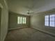 Spacious bedroom with neutral decor, carpeting, and ceiling fan at 5981 Brundage Ln, Norcross, GA 30071