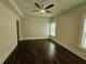 Bright bedroom featuring hardwood floors and ceiling fan at 5981 Brundage Ln, Norcross, GA 30071