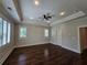 Spacious bedroom with hardwood floors, plantation shutters, and ceiling fan at 5981 Brundage Ln, Norcross, GA 30071