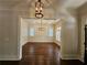 Formal dining room with hardwood floors and a beautiful chandelier at 5981 Brundage Ln, Norcross, GA 30071