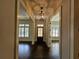 Bright entryway with hardwood floors and elegant light fixture at 5981 Brundage Ln, Norcross, GA 30071