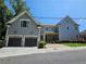 Two-story home with two-car garage, landscaping, and brick accents at 5981 Brundage Ln, Norcross, GA 30071