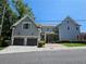 Two-story home with two-car garage, landscaping, and brick accents at 5981 Brundage Ln, Norcross, GA 30071