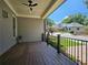 Spacious front porch with wooden deck and metal railing, overlooking the street at 5981 Brundage Ln, Norcross, GA 30071
