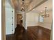 Hardwood floors and stylish light fixtures in this elegant hallway at 5981 Brundage Ln, Norcross, GA 30071