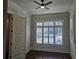 Bright home office features hardwood floors, plantation shutters, and ceiling fan at 5981 Brundage Ln, Norcross, GA 30071