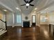 Bright living room with hardwood floors, fireplace, and plenty of natural light at 5981 Brundage Ln, Norcross, GA 30071