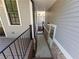 Side yard with walkway leading to a secondary entrance and deck at 5981 Brundage Ln, Norcross, GA 30071