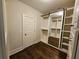 Spacious walk-in closet with mirrored sliding doors and ample shelving at 5981 Brundage Ln, Norcross, GA 30071