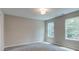 Bedroom with two windows and grey carpet at 0 Bouldercrest Rd Se, Ellenwood, GA 30294