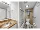 Full bathroom with shower/tub combo, updated fixtures, and stylish wallpaper at 141 Maison Nw Pl, Atlanta, GA 30327