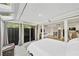 Main bedroom with sunroom access and view of backyard at 141 Maison Nw Pl, Atlanta, GA 30327