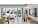 Open bedroom with a sunroom and a view into the living space at 141 Maison Nw Pl, Atlanta, GA 30327
