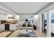 Inviting living space featuring an open floor plan with a kitchen, living room, and bedroom at 141 Maison Nw Pl, Atlanta, GA 30327